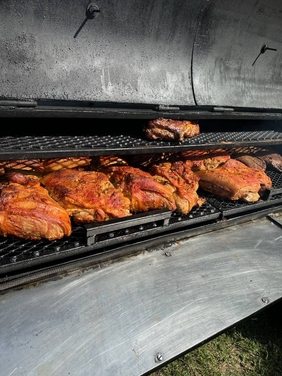 Smoked pork shoulders on the grill