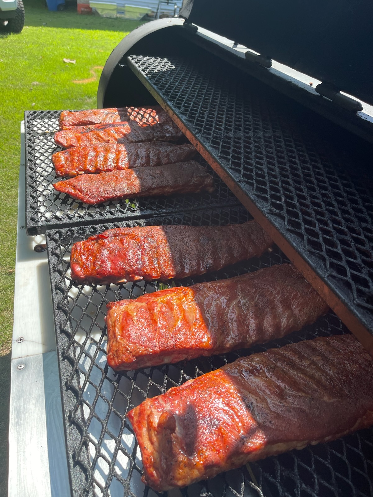 Spare ribs glazing on the smoker